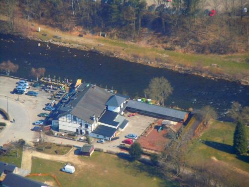 an aerial view of a gas station next to a river at Hotel Val De La Cascade in Stavelot