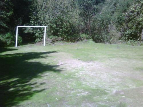 a soccer goal in the middle of a field at Refugios Olmue Santa Teresa in El Maqui