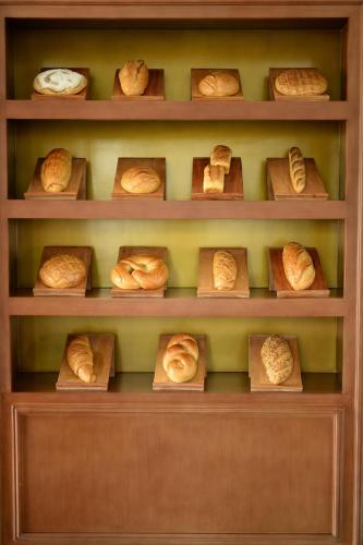 a shelf filled with lots of croissants at Hotel Carlito Tagaytay in Tagaytay