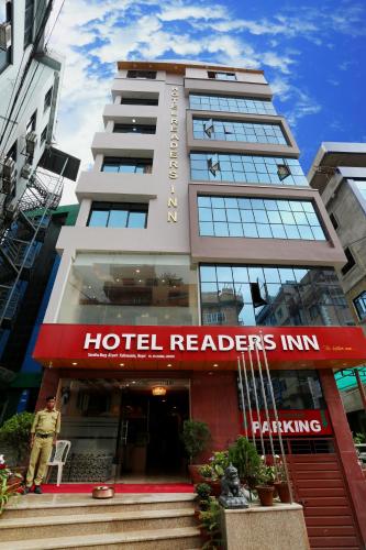 a hotel reader inn with a man standing in front of it at Hotel Readers Inn Pvt.Ltd in Kathmandu