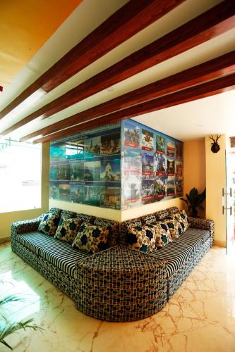 a living room with a couch in a room at Hotel Readers Inn Pvt.Ltd in Kathmandu
