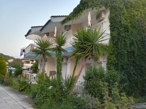 a building with plants on the side of it at Christina Apartments in Fourka
