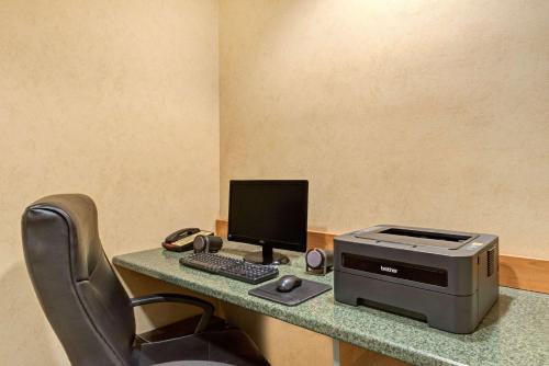 a desk with a computer and a printer on it at York Microtel Inn & Suites by Wyndham in York