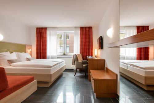 Postel nebo postele na pokoji v ubytování Hotel Europa