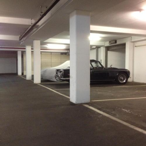 a car is parked in a parking lot at Hotel Post Viernheim in Viernheim