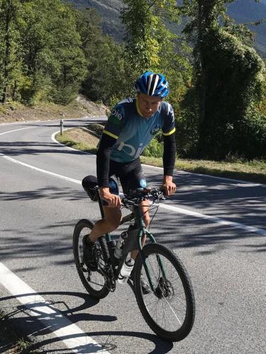a man riding a bike down a road at Le Preyet in Veysonnaz