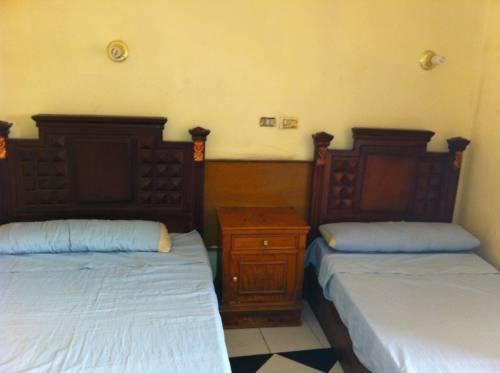 Ένα ή περισσότερα κρεβάτια σε δωμάτιο στο Nubian oasis hotel