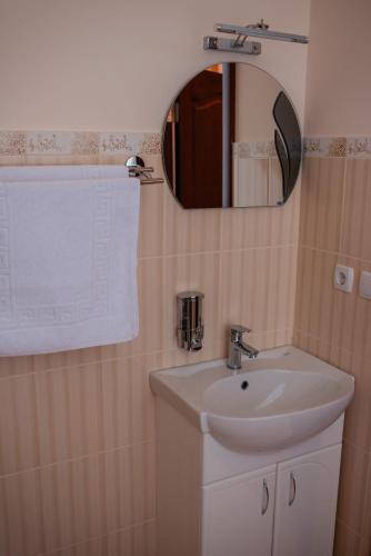 a bathroom with a sink and a mirror at Vershnyk in Cherkasy