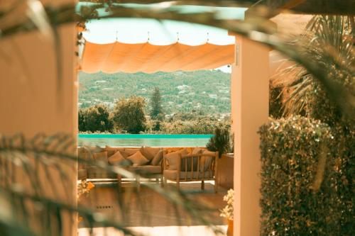a view of a pool from a house with a patio at Can Arabí in Ibiza Town