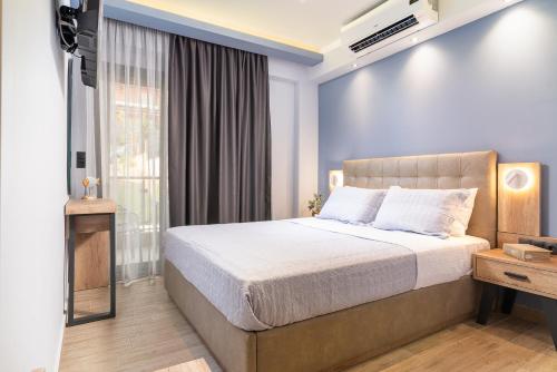 a bedroom with a large bed and a window at Oasis in Sarti