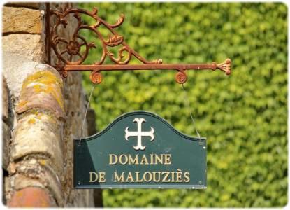 a sign on a building with a sign on it at Domaine de Malouziès in Fontiers-Cabardès