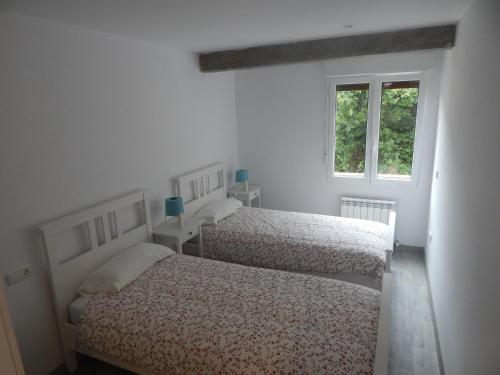 A bed or beds in a room at San Jose Blue