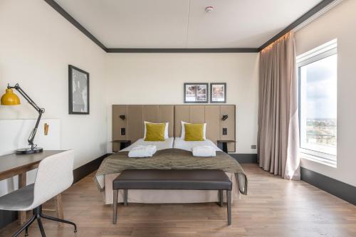 Ένα ή περισσότερα κρεβάτια σε δωμάτιο στο Quality Hotel View