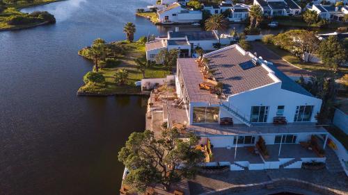 an aerial view of a house on the water at Marina Views in Muizenberg