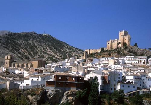 a town on top of a hill with a castle at La Casa de Sally- Vèlez Blanco in Vélez Blanco