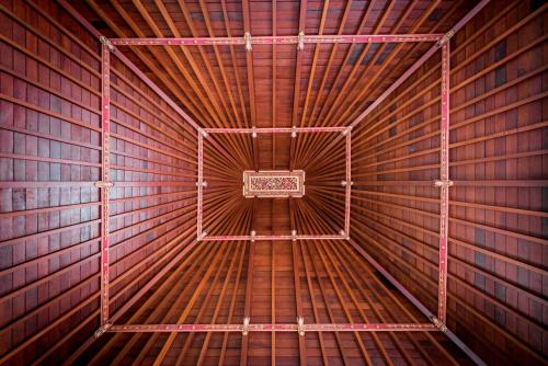 an inside view of a metal frame of a tunnel at Sitala Villa in Ubud