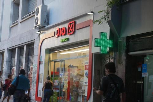 a store with people walking in front of it at SUITE 76 en Apart Lima 265 in Buenos Aires