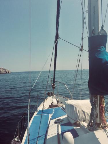 a sail boat in the water on the ocean at Ag Thekla Est 1924 in Skinária