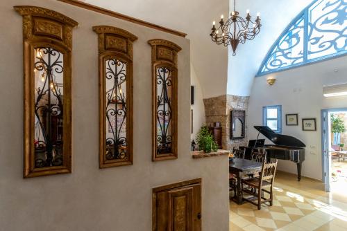a room with a bunch of stained glass windows at Arabesque Arts & Residency in ‘Akko
