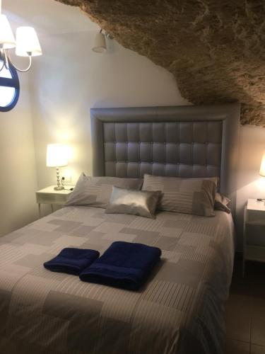 En eller flere senge i et værelse på Casa Cueva Un Rincón en la Roca