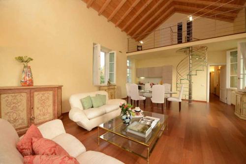 a living room with a couch and a table at Villa Verganti Veronesi in Inveruno