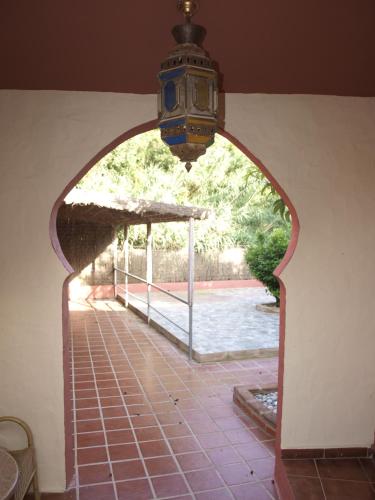 an archway with a view of a swimming pool at Hotel Copacabana Tarifa Beach in Tarifa