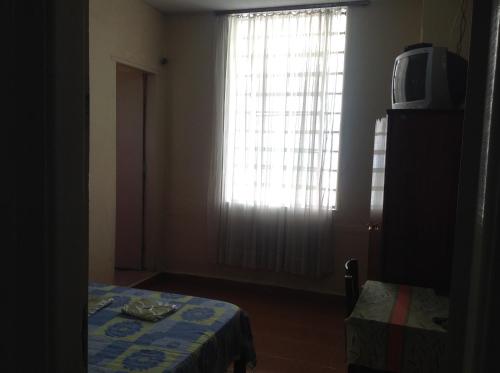 Postel nebo postele na pokoji v ubytování Hotel Chaves - Quartos Individuais