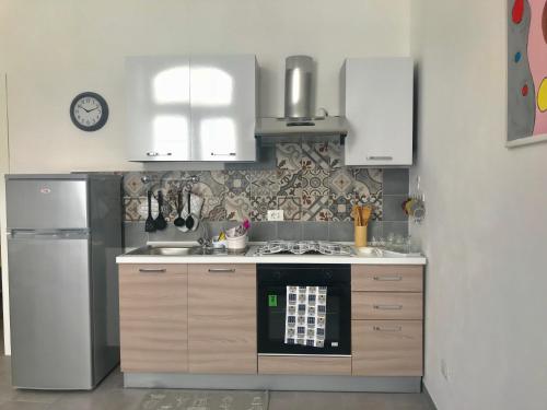 Kuchyň nebo kuchyňský kout v ubytování Be in Sicily