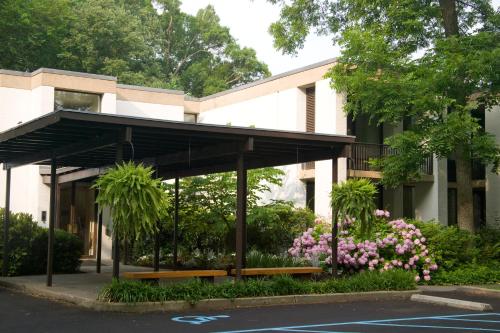 a building with awning and flowers in front of it at Griffin Hotel, an official Colonial Williamsburg Hotel in Williamsburg