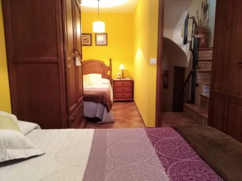 מיטה או מיטות בחדר ב-Casa Tiretes