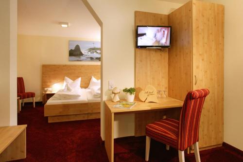 En eller flere senge i et værelse på Natur- und Sporthotel Zuflucht