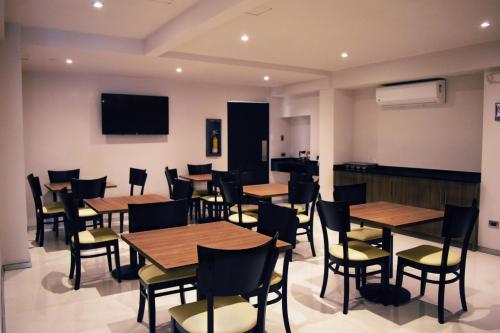 TV in/ali zabaviščno središče v nastanitvi Hotel Ht Ole