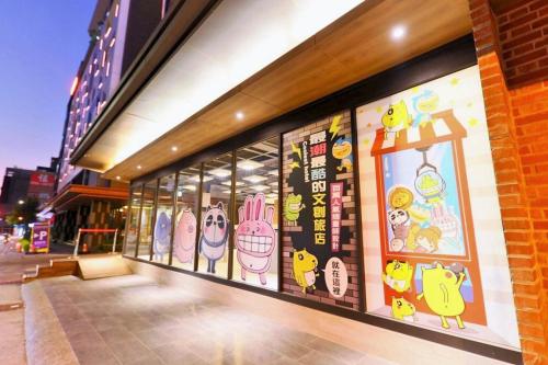 a store front with hello kitty graphics on the wall at Whoops Hotel in Taichung
