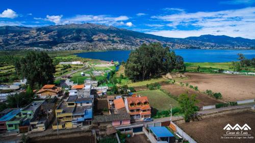 an aerial view of a village next to a body of water at Casa de Luis in Otavalo