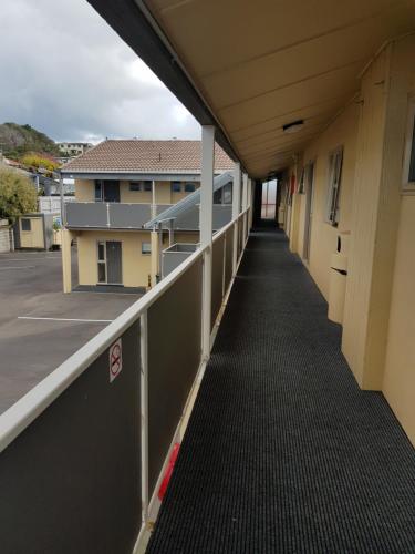 an empty hallway of a building with a walkway at 299 On Devon West in New Plymouth