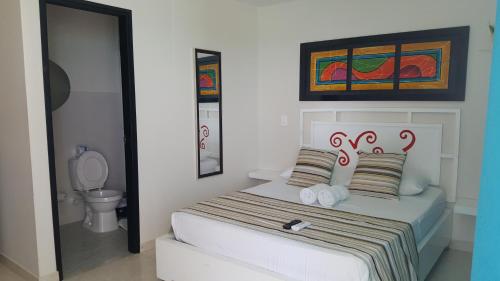 Un pat sau paturi într-o cameră la Caribbean Island Hotel Piso 2