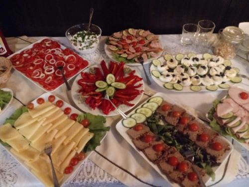 a table with many different types of food on it at Hotel Orlik in Płońsk