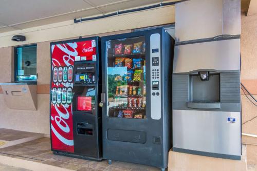 a coca cola vending machine in a store at Motel 6-Marshall, TX in Marshall