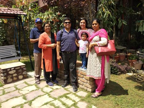 a group of people posing for a picture at Oxygen Homestay-A Blissful Retreat in Dehradun