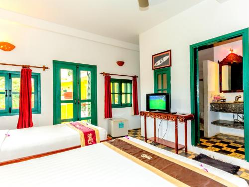Ένα ή περισσότερα κρεβάτια σε δωμάτιο στο Residence Wat Damnak