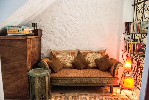 a living room with a couch and a table at Riad Dar Latigeo in Essaouira