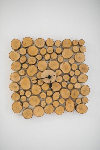 a clock made out of coins on a white background at Chalet Ana Bohinj in Bohinj