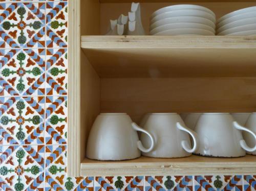 a cupboard with dishes and plates in it at Agriturismo La Derta in Bellagio