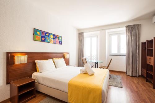Кровать или кровати в номере Residencial Mar e Sol