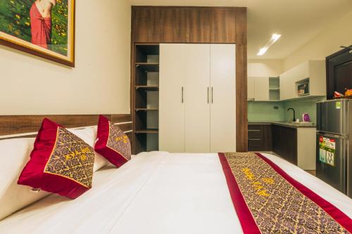 Giường trong phòng chung tại AVA Hotel & Apartment