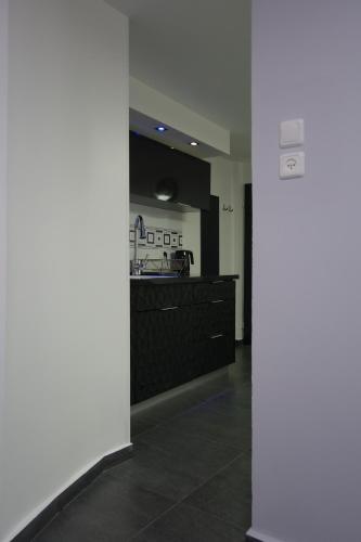 a kitchen with a counter in a room at Cozy modern apartment near the sea in city center in Netanya