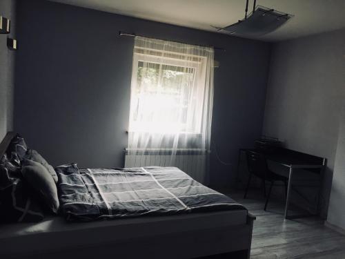 Łóżko lub łóżka w pokoju w obiekcie Apartament Ala