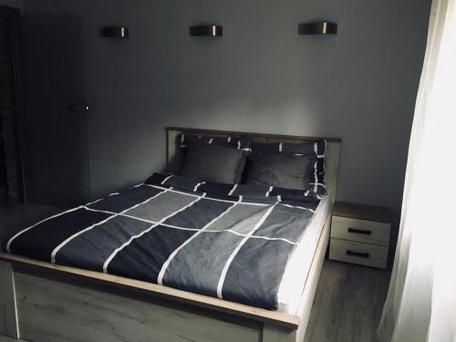 Łóżko lub łóżka w pokoju w obiekcie Apartament Ala