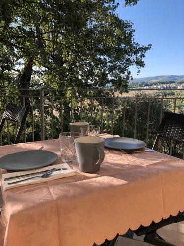 a table with plates and napkins on top at Arts Club Suite & Spa in Chianciano Terme