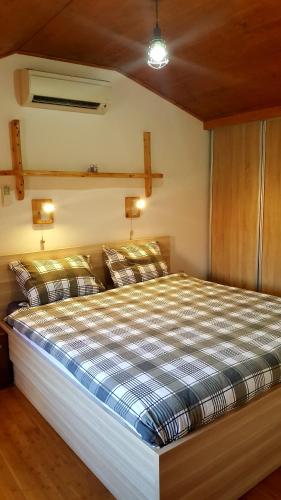 a bedroom with a bed with two pillows on it at Apartment Korcula in Korčula